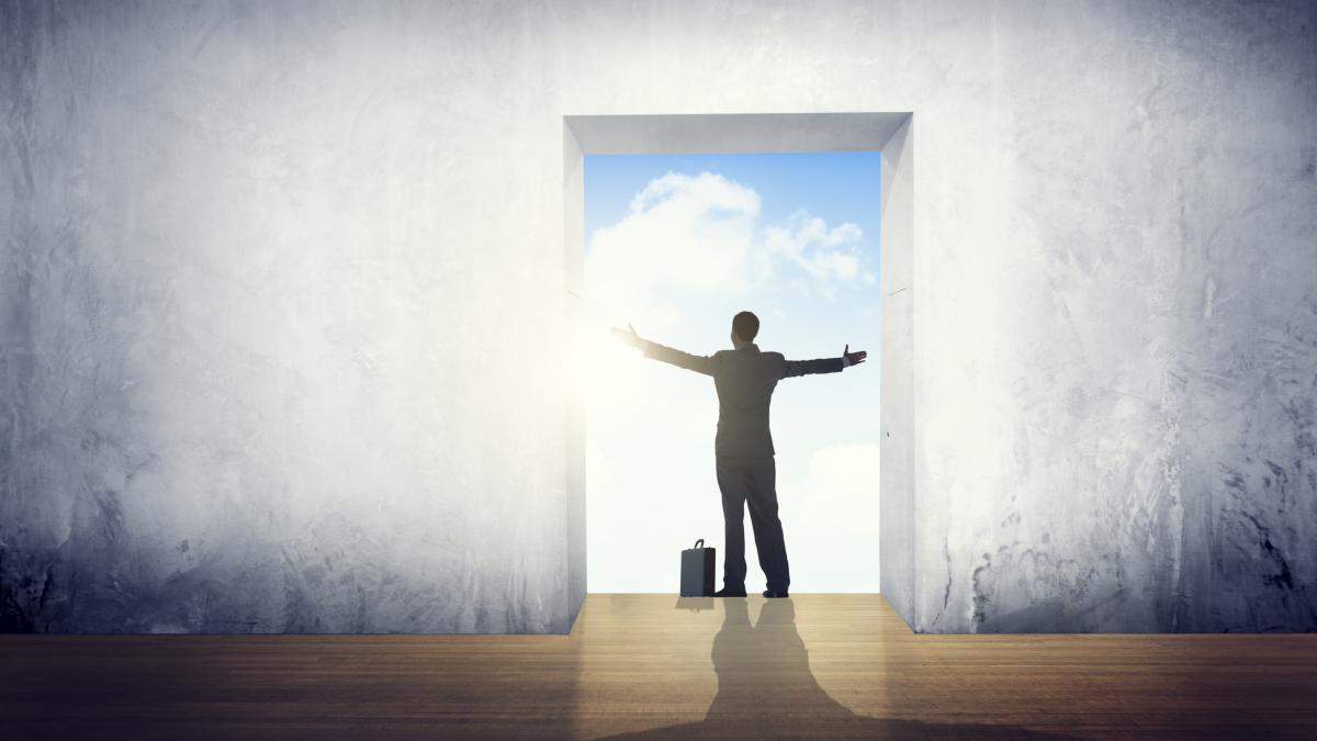 businessman-satisfaction-arms-outstretched-freedom-concept