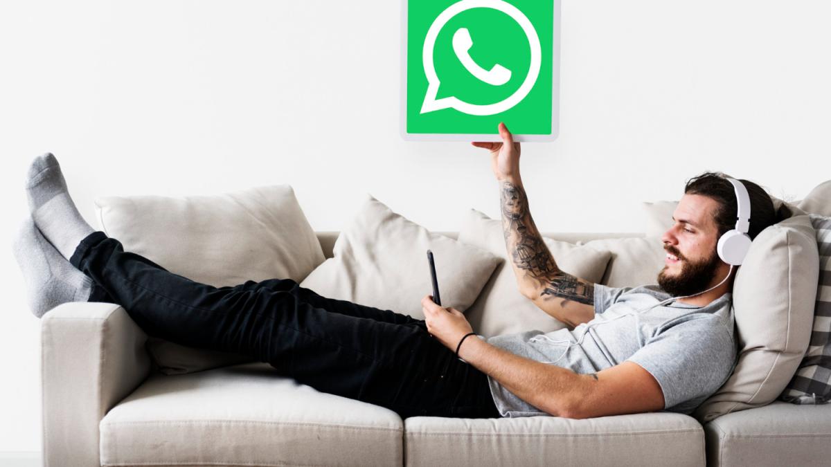 man-showing-whatsapp-messenger-icon