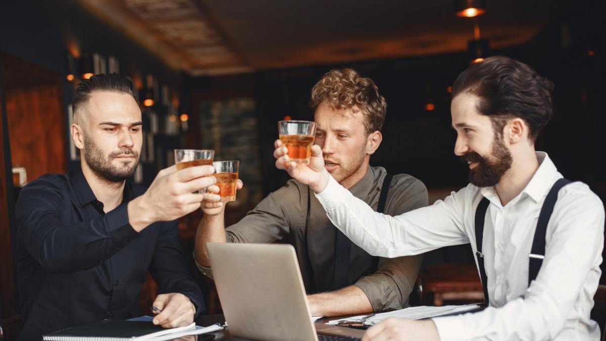 businessmen-negotiations-men-with-alcohol-sitting-table-friends-are-talking_10837100