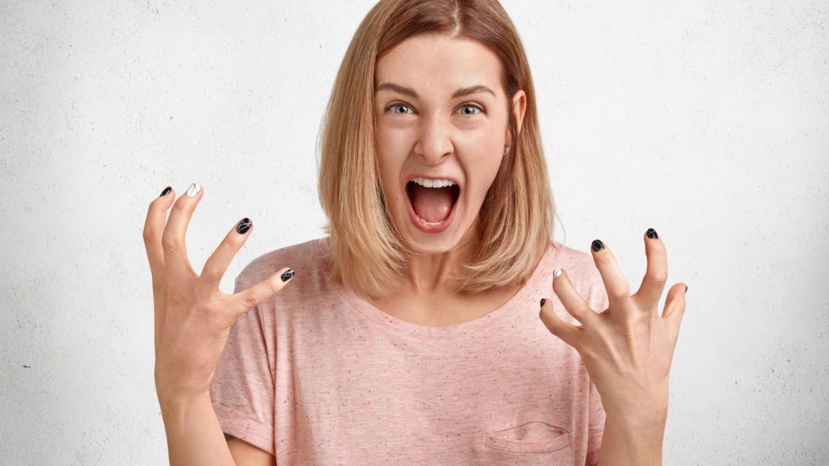 mad-irritated-young-woman-screams-loudly-gestures-actively-being-dissatisfied-annoyed-with-something-expresses-her-displeasure-annoyance_98866300