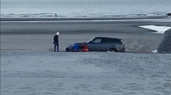 Belgia. Un ROMÂN a îngropat un SUV de lux nou-nouț pe plajă (FOTO)