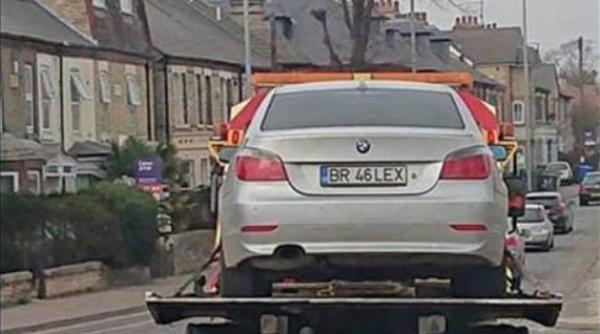 BMW românesc RIDICAT de pe o stradă din Londra. "Raportez orice român cu cazanul înscris pe România"