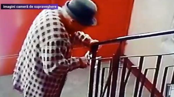 Pensionară româncă, filmată când distruge aparatul cu dezinfectant din scara blocului. Ce face apoi cu obiectul