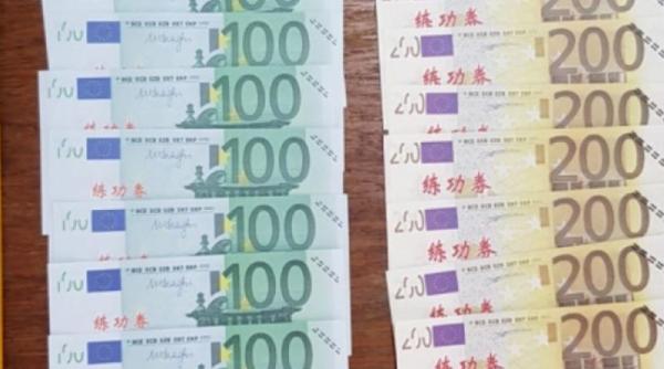 Peste jumătate de milion de euro falsificaţi, descoperiţi  la domiciliul unor români. Bărbații plasau pe piaţă bancnote false