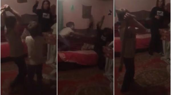 VIDEO-Româncă bătută cu parul de copiii săi minori, spre amuzamentul tatălui. Totul a fost transmis LIVE pe Facebook 