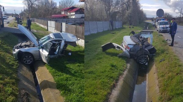 Un român a ieșit pe picioarele lui dintr-un BMW rupt în două în accident: Jumătate din maşină, aruncată pe partea opusă a drumului