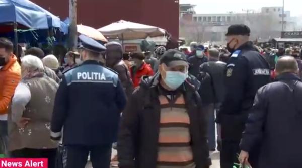 Explicațiile românilor din piață pentru masca purtată sub nas: „Nu mi-e teamă. Nu cred în el, dar din obligativitatea legii, port”