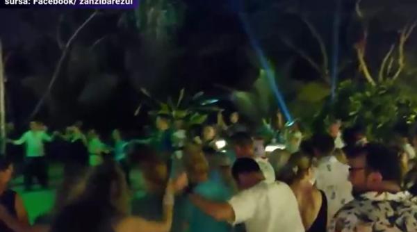 Petrecere românească pe o plajă din Zanzibar. Horă pe muzică machedonească, printre palmieri - VIDEO