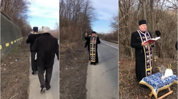 Imagini virale cu un preot care sfințește „curba morții” de pe DN11 - VIDEO