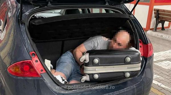 Un român căutat de poliție a încercat să fugă din țară ascuns în portbagaj